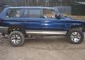 Mitsubishi Pajero Sport części karoserii napędy koła amory