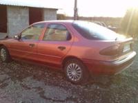 sprzedam Ford Mondeo MK1 Ghia (bogata wersja) poj. 2.0 136KM 1993r hatchback benzyna + gaz ABS opony letnie na orginalnych alufelgach opony zimowe na felgach stalowych centralny zamek 4x el. szyby el. lusterka klimatyzacja poduszka powietrzna el.