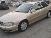 Opel Omega DTI 2.2 wersja sedan CZ pilot 4xPP WK kierownica wielofunkcyjna 4xES EL K dwustrefowy ABS czujniki parkowania lampy ksenony R+CD tapicerka welurowa wstawki drewnopodobne.Auto dobrze utrzymane,sprowadzone z Niemiec, 2 lata w kraju.Stan samochodu